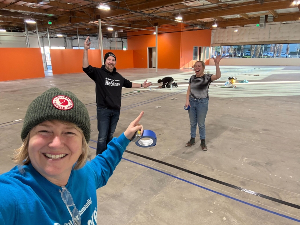 ReStore staff tape stripes on new Tigard floor