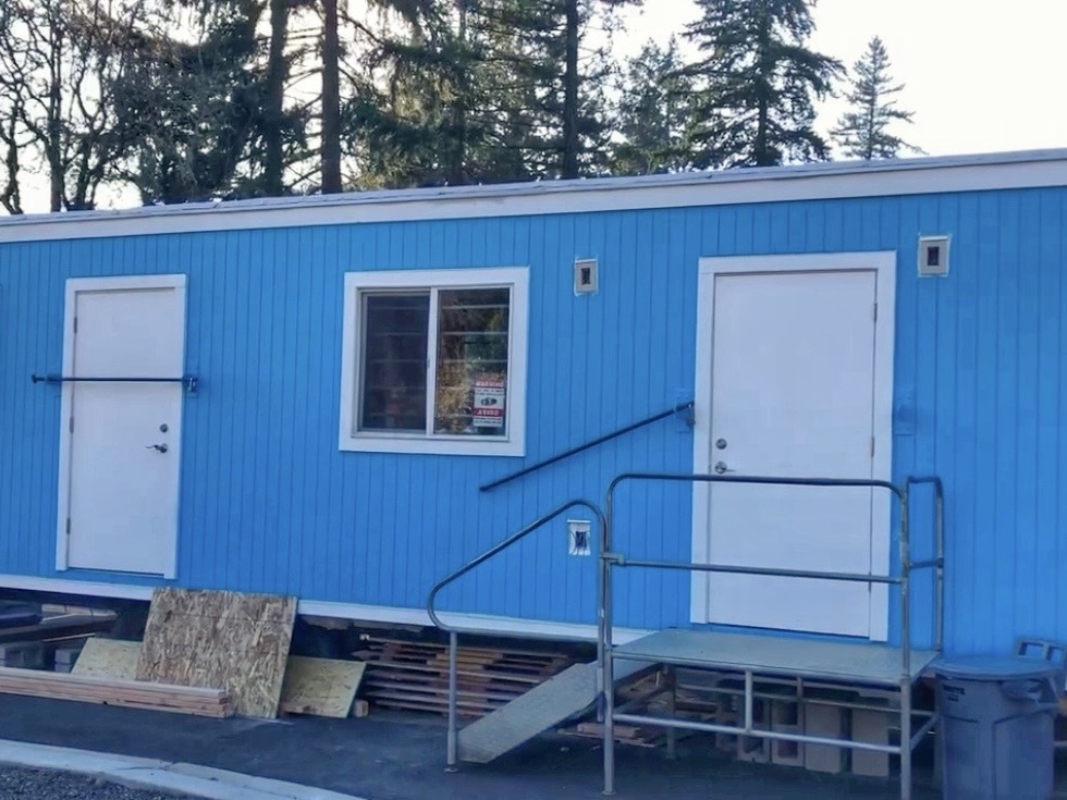 Job trailer has been freshly painted in a bright blue with white trim