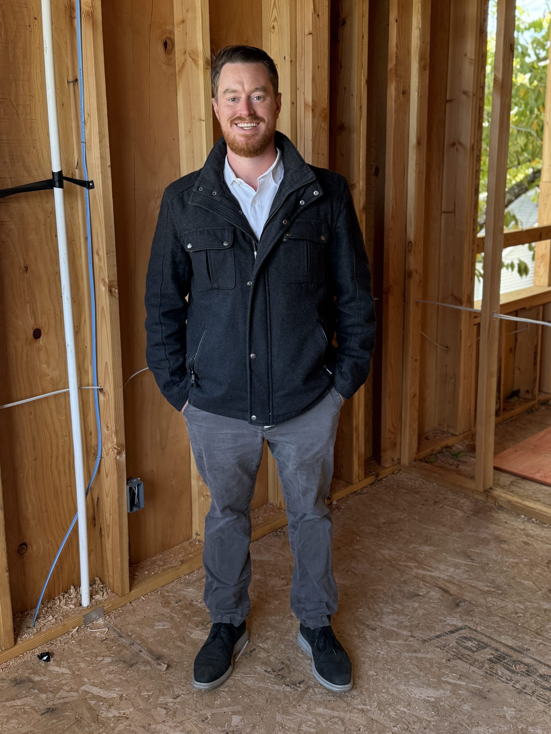 Daniel Silvey of DBS Group poses at Habitat's Magnolia Crossing property in SE Portland.
