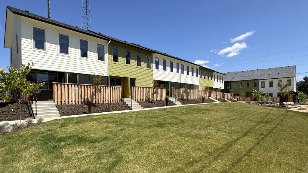 Habitat's King City Commons community looks bright and tidy on a sunny day. The community is recently finished and features new plantings.