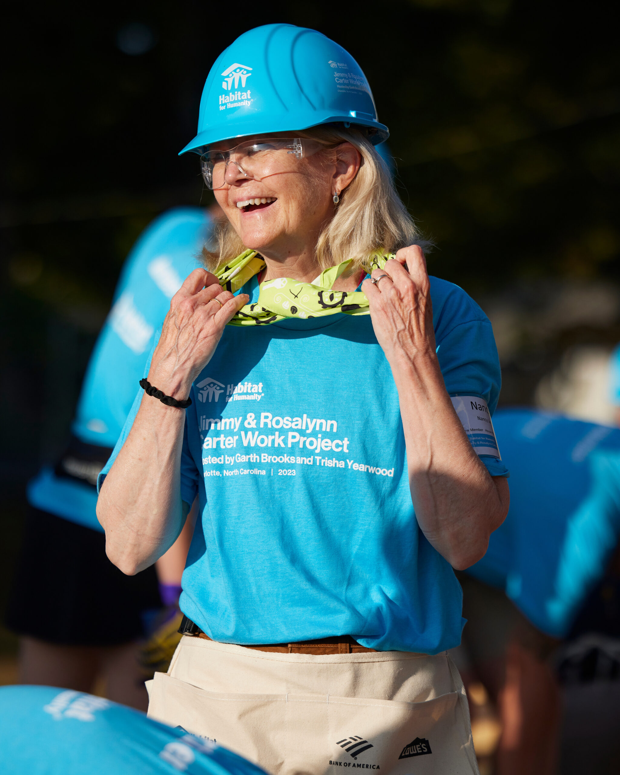 Habitat for Humanity Portland Region board chair Nancy Lee smiles, looking happily around her at the 2025 Carter Work Project.