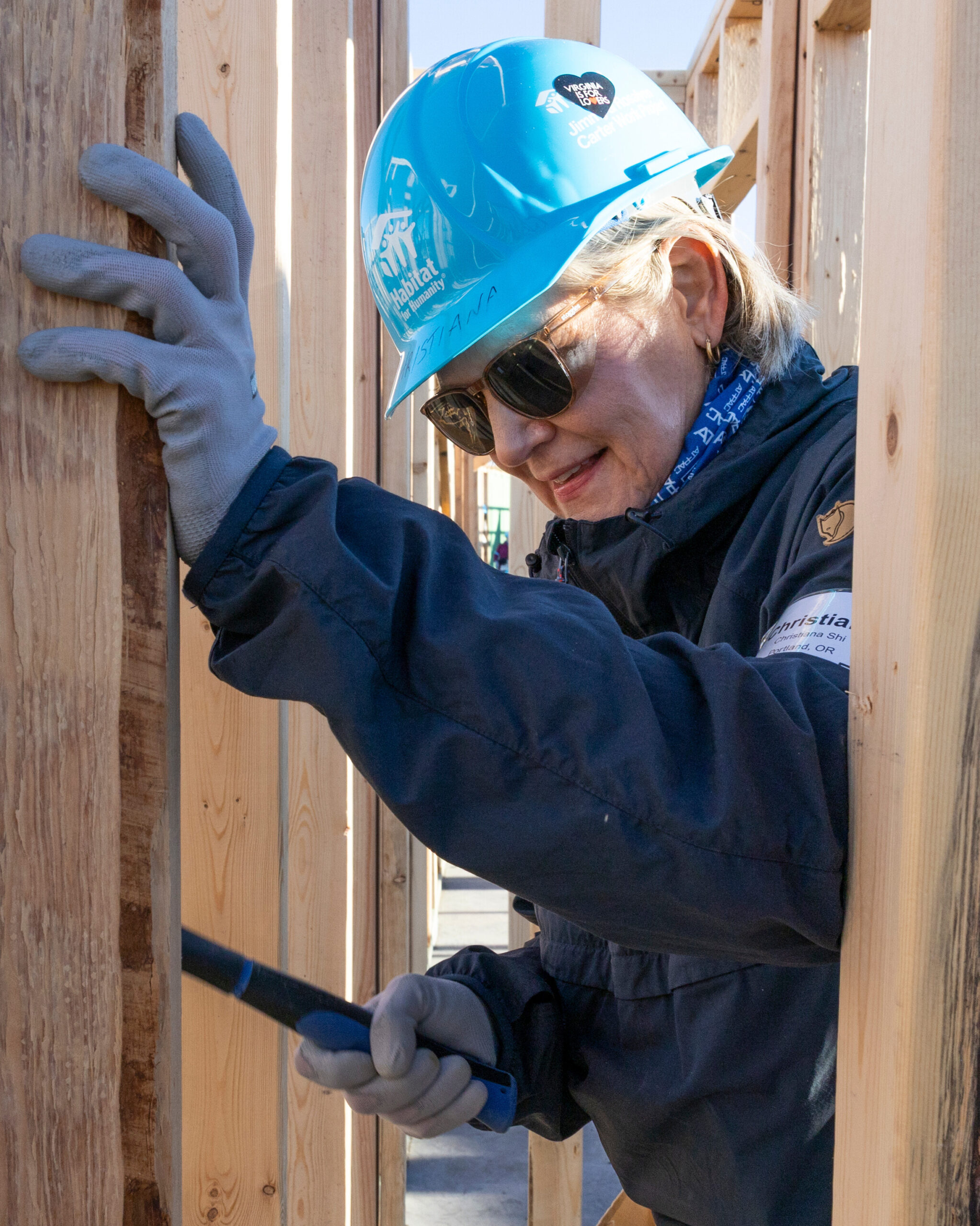 Christiana Smith-Shi, board member of Habitat for Humanity's international organization, hammers into a beam at the 2025 Carter Work Project.
