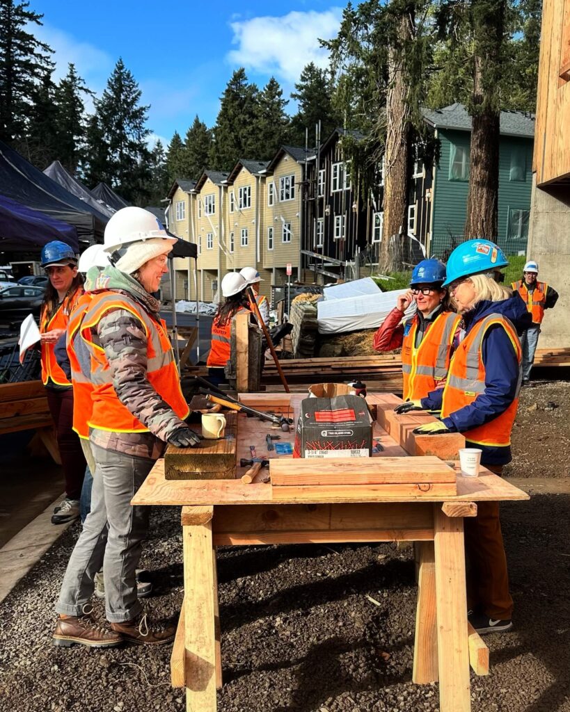Sarah learns hands-on building skills from members of CREW during Habitat's Women+ Build event.